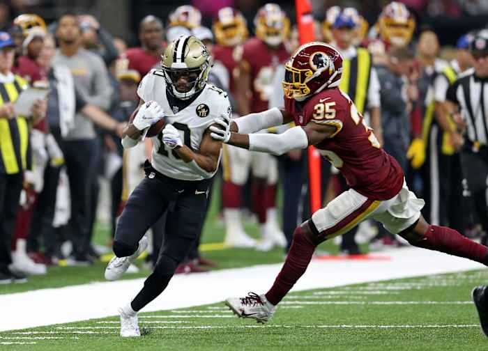 New Orleans receiver Tre'Quan Smith (10) runs for a touchdown against Redskins safety Montae Nicholson (35). Saints quarterback Drew Brees (not pictured) set the all-time NFL passing yardage mark on this play. Mandatory Credit: Chuck Cook-USA TODAY